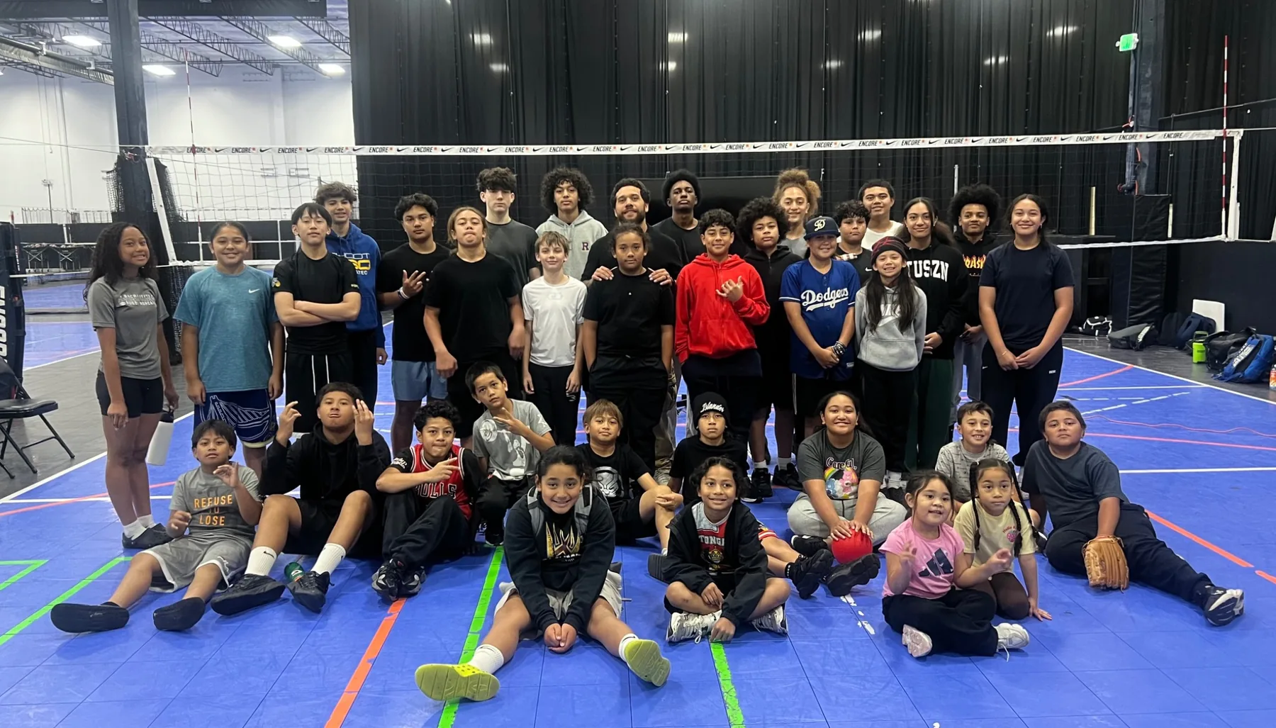 ProEdge students and staff gathered on an indoor court