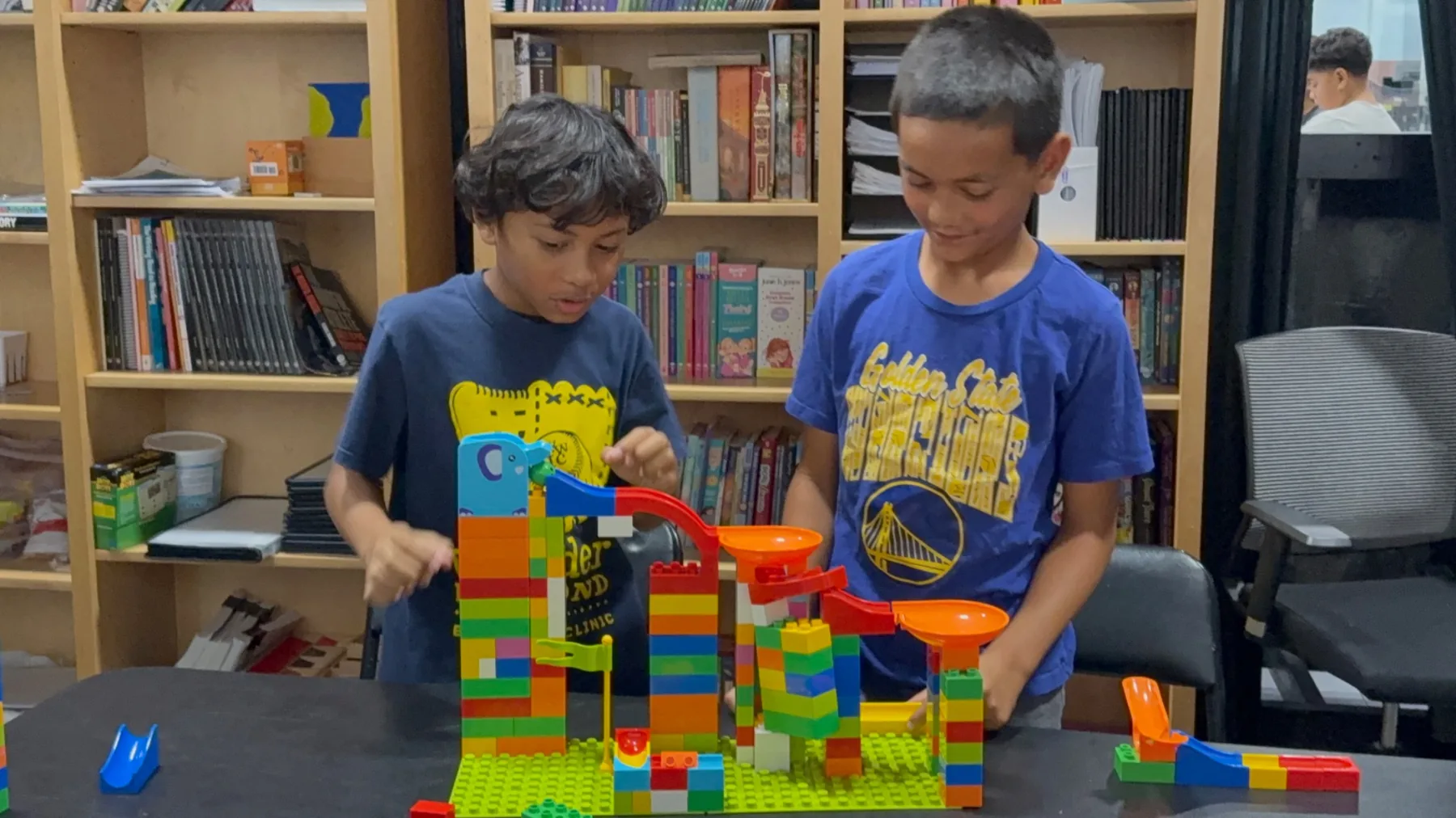 Two students collaborating on a hands-on building project