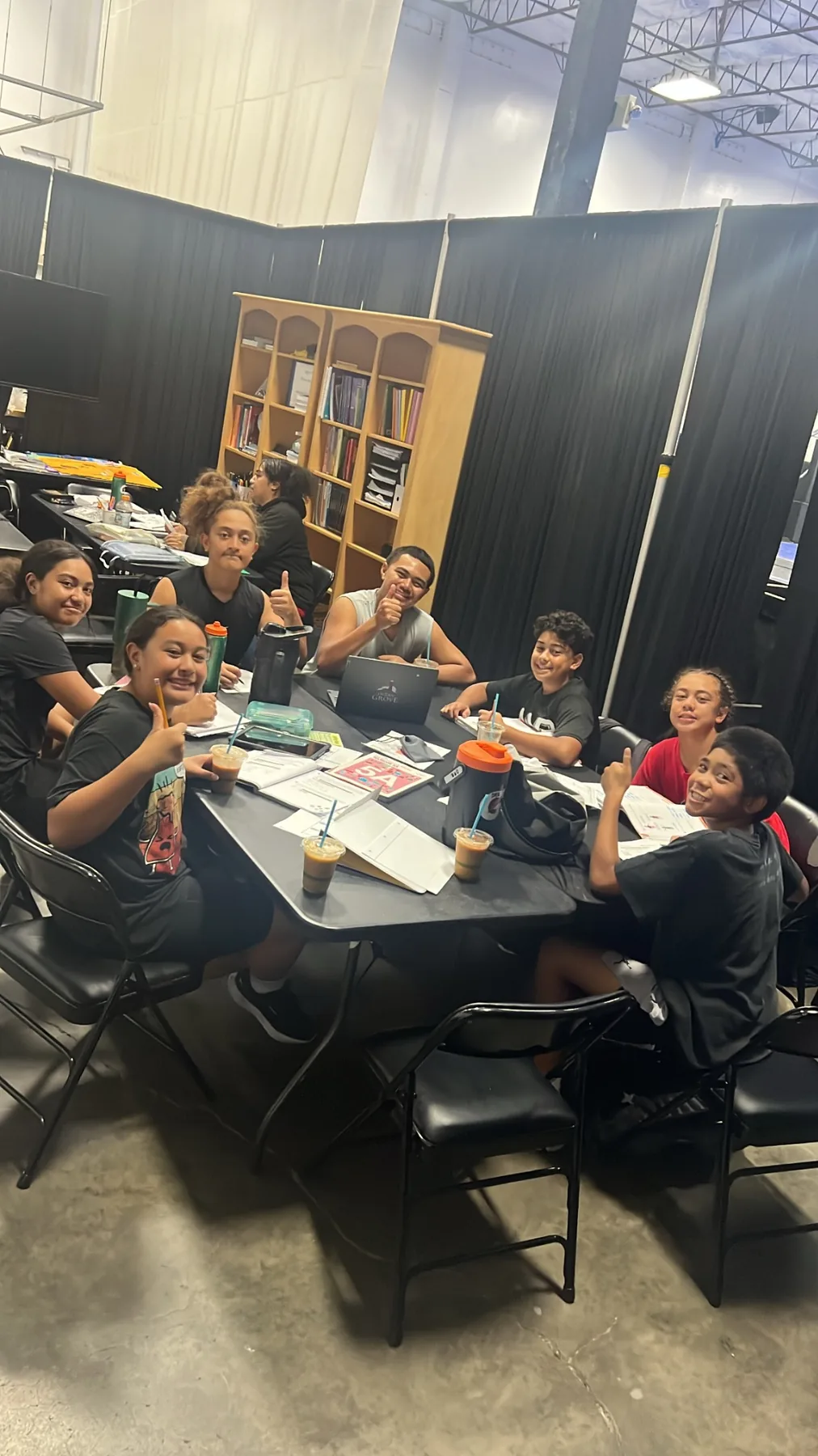 Students smiling together during a small-group learning session