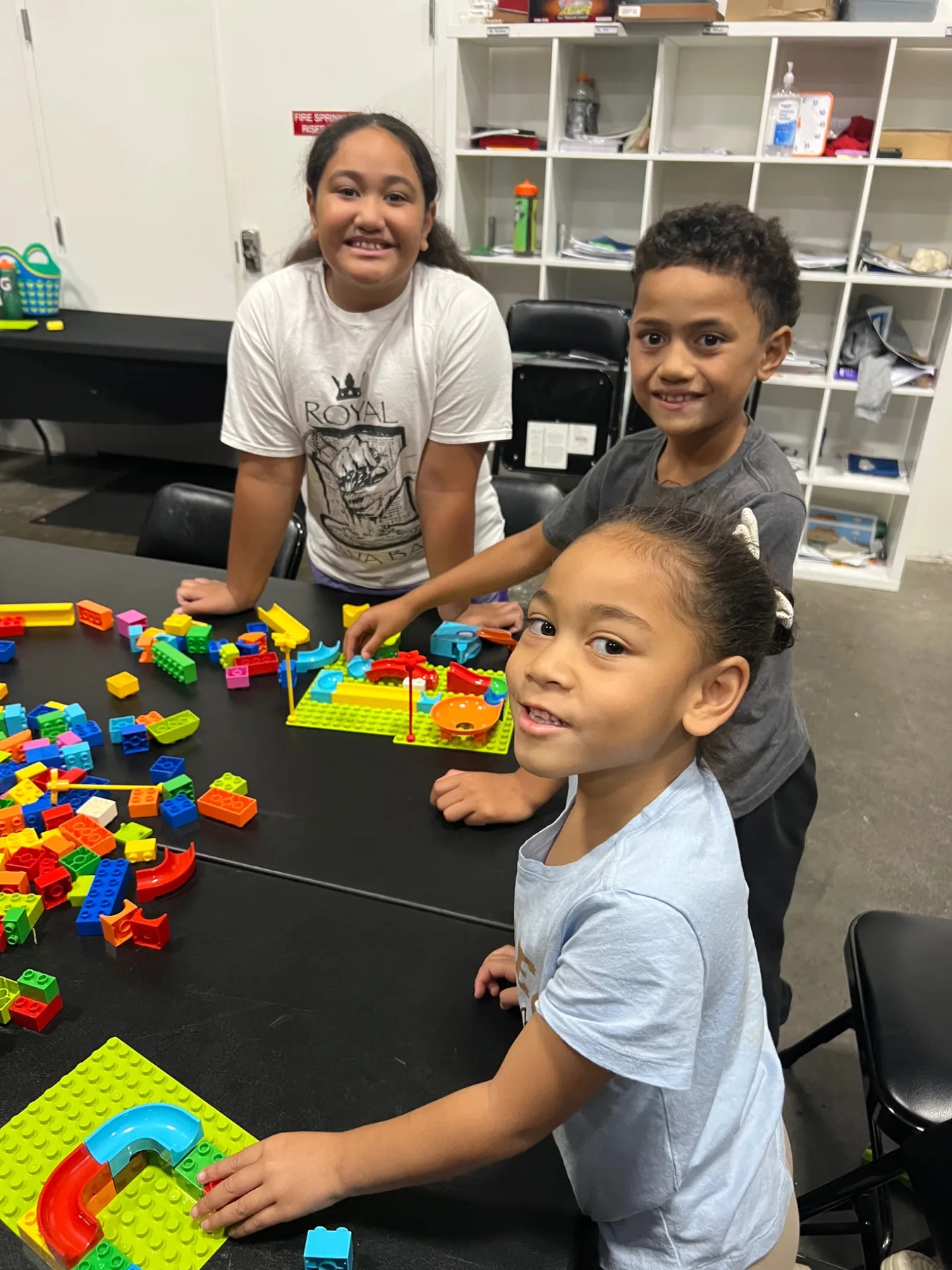 Students smiling during a hands-on learning activity